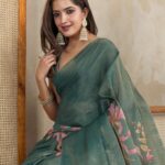 Elegant Teal Green Linen Saree with Pink Floral Print and Subtle Zari Weave